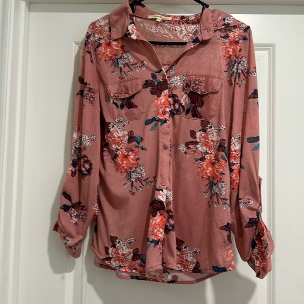 Women’s size large top with lace detail on back.